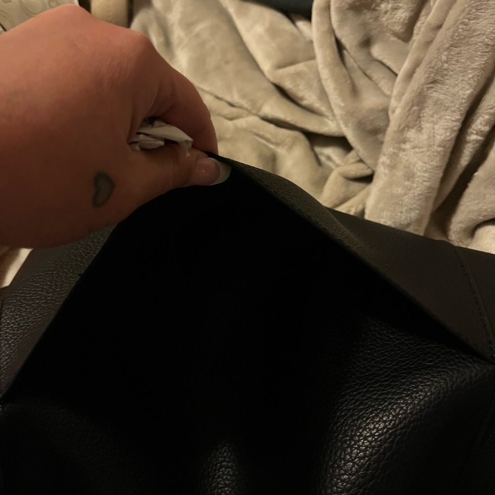 Black Steve Madden bag with gold chains and a big wristlet